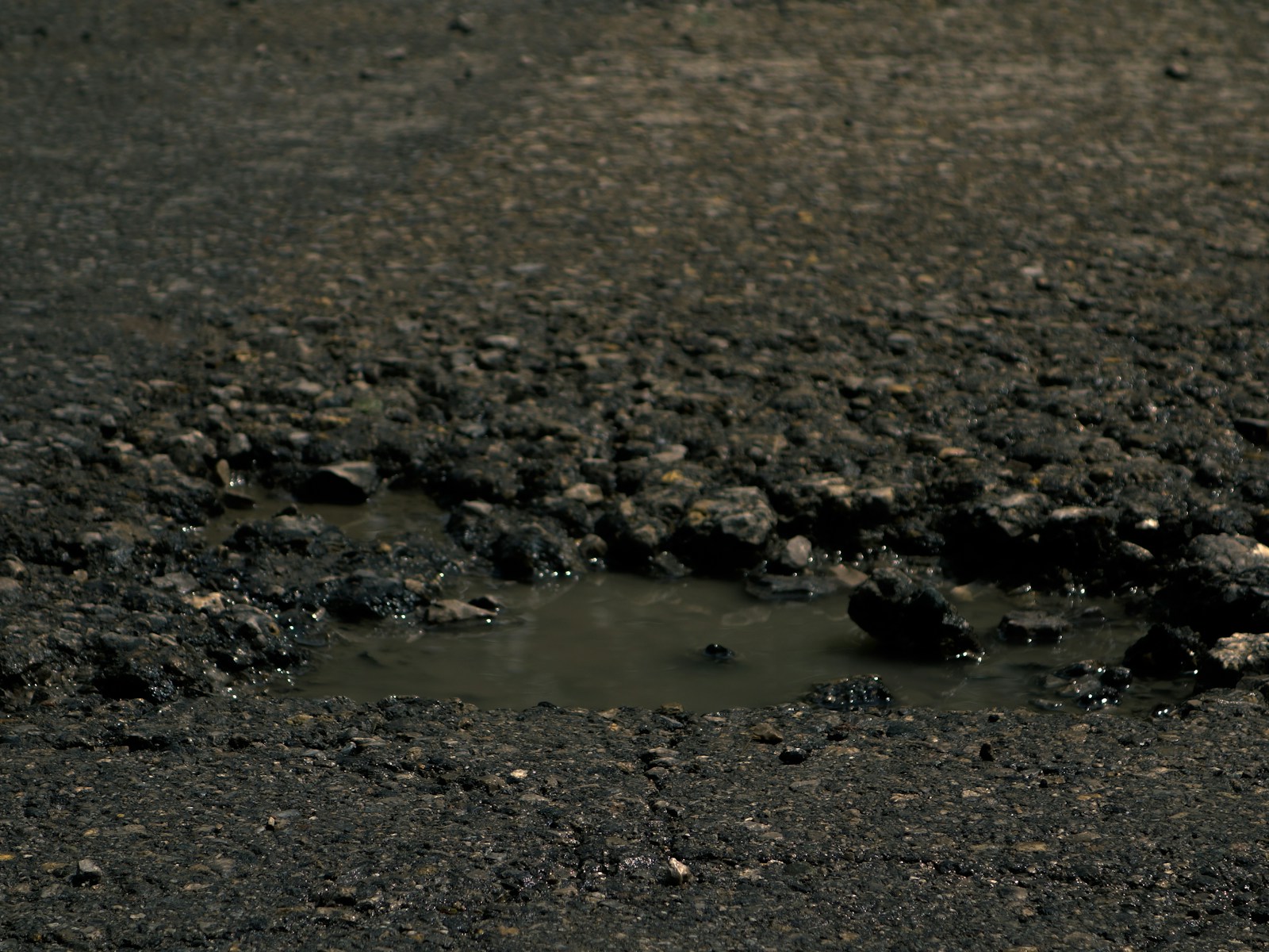 a muddy area with a hole in it