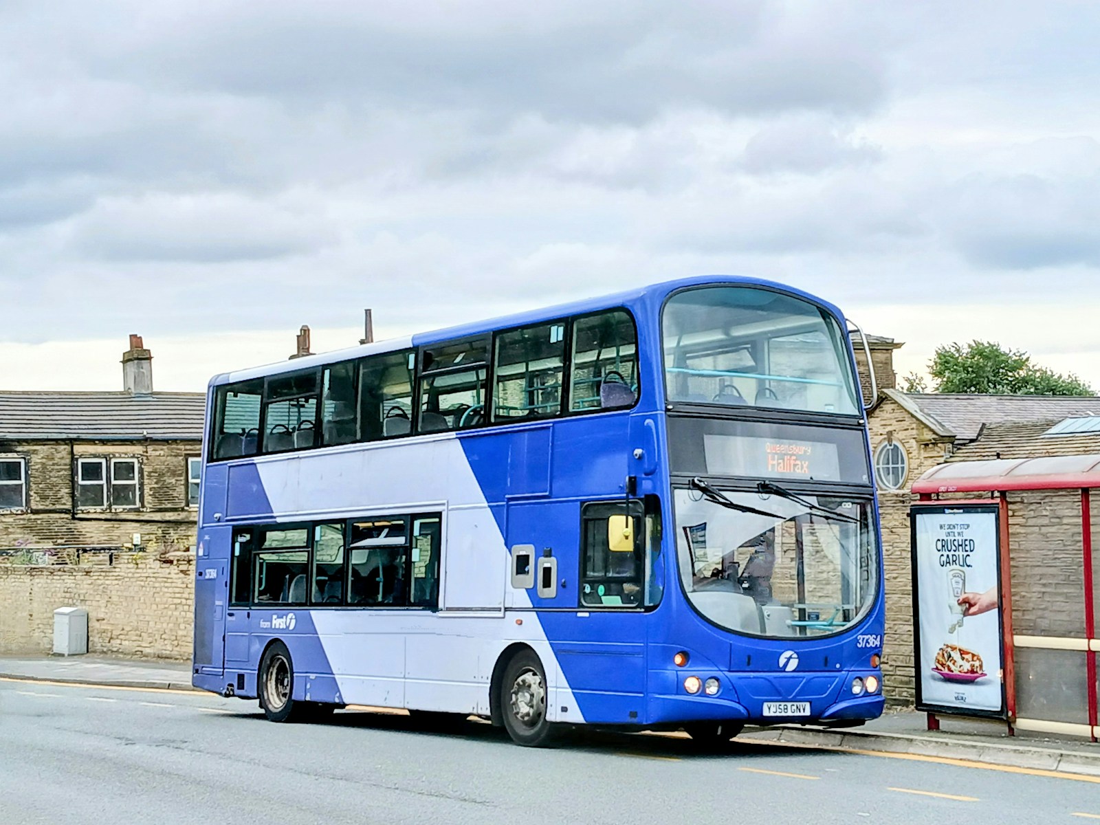A double decker bus parked on the side of the road